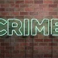 brick wall with Crime written